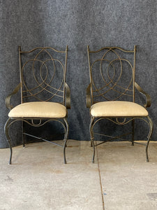 Pair of Wrought Iron Armchairs With Cream Upholstered Seats.